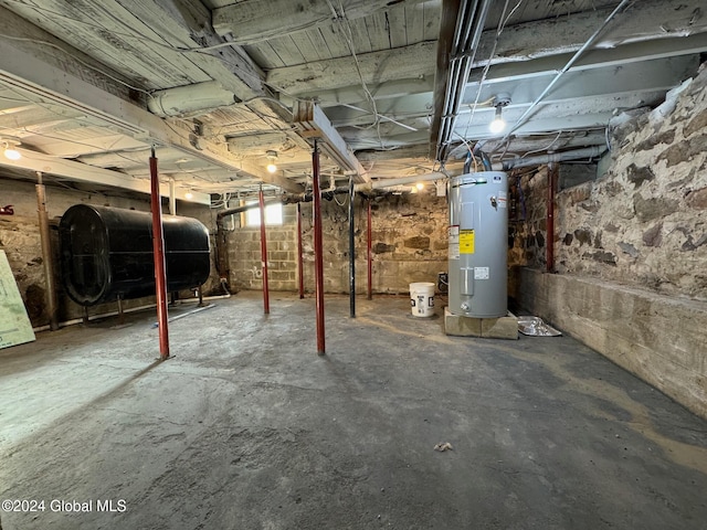 unfinished below grade area with heating fuel and electric water heater