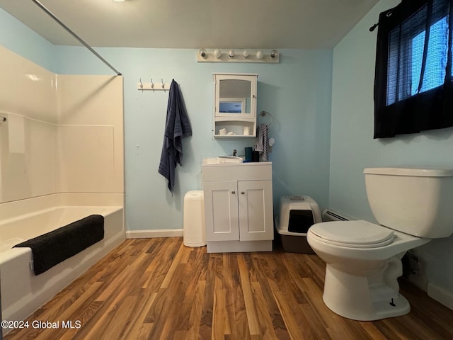 full bathroom with vanity, hardwood / wood-style floors, toilet, and shower / bathtub combination