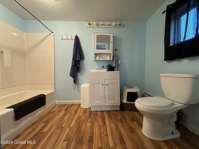full bathroom with shower / tub combination, wood finished floors, toilet, and vanity
