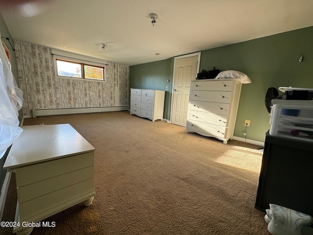 bedroom featuring carpet, a baseboard heating unit, and baseboards