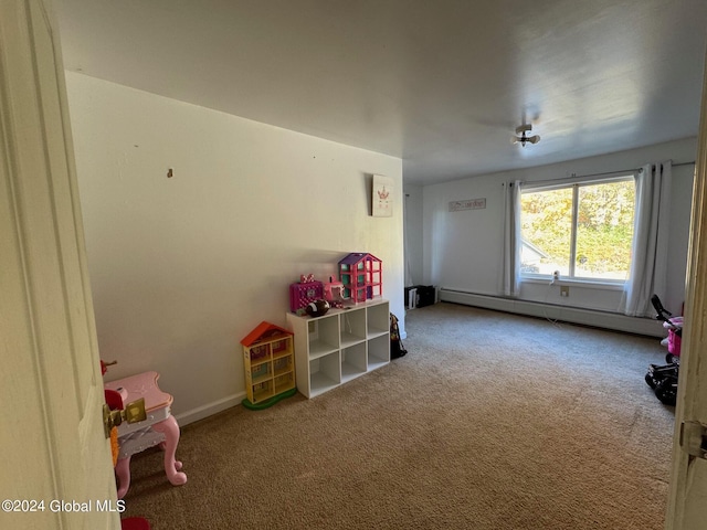 game room featuring a baseboard heating unit and carpet flooring