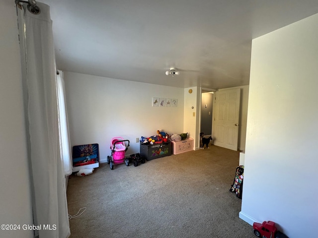 rec room featuring carpet flooring
