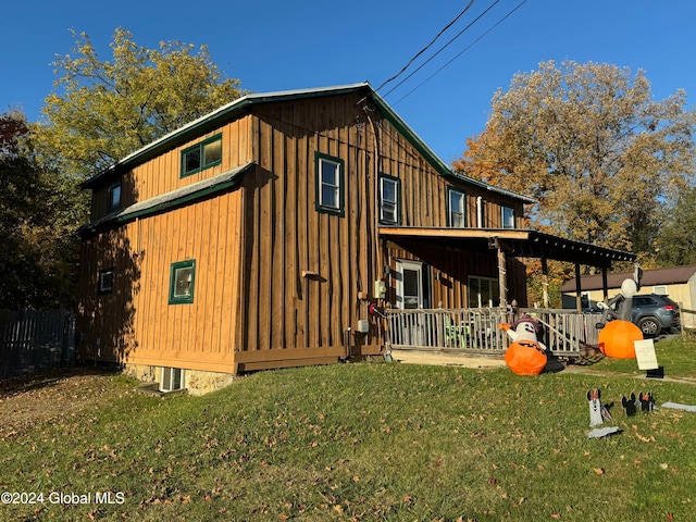 back of property with a yard