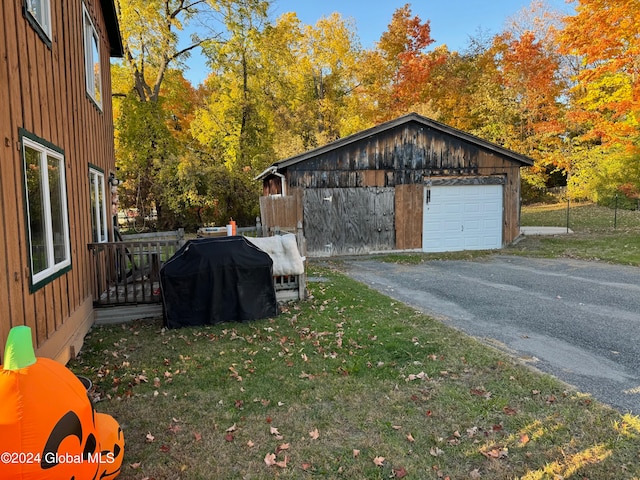 exterior space with a yard and wooden walls