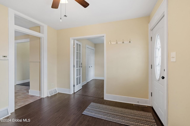 foyer entrance featuring ceiling fan and dark hardwood / wood-style flooring