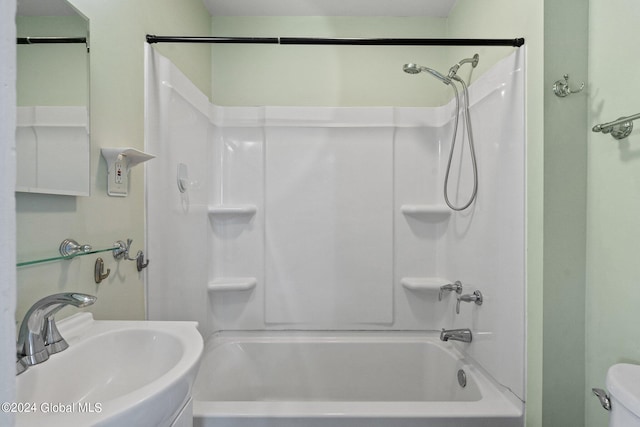 full bathroom featuring toilet, sink, and shower / bath combination