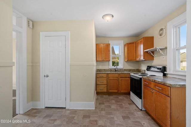 kitchen with sink and electric range