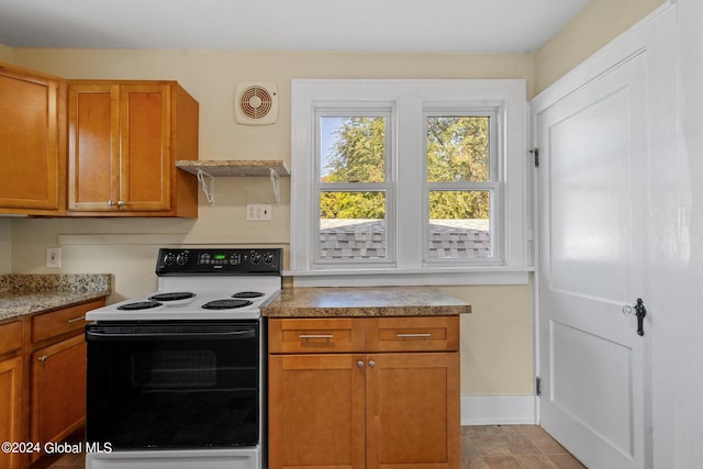 kitchen featuring white electric stove