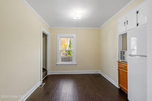 unfurnished dining area with crown molding and dark hardwood / wood-style floors