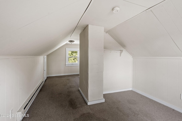 bonus room with baseboard heating, lofted ceiling, and dark carpet