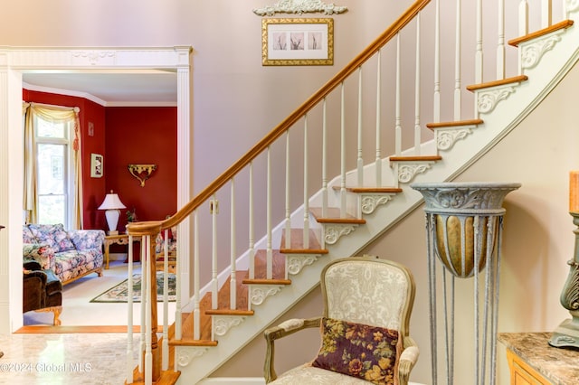 staircase with crown molding