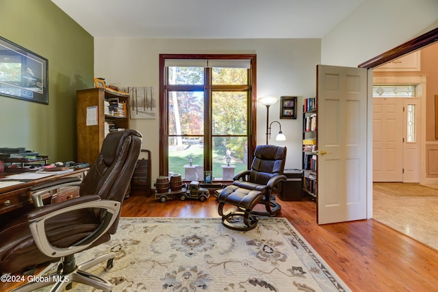 office space with wood-type flooring