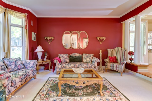 living room featuring ornate columns, ornamental molding, and carpet floors