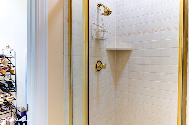 bathroom with a shower with door