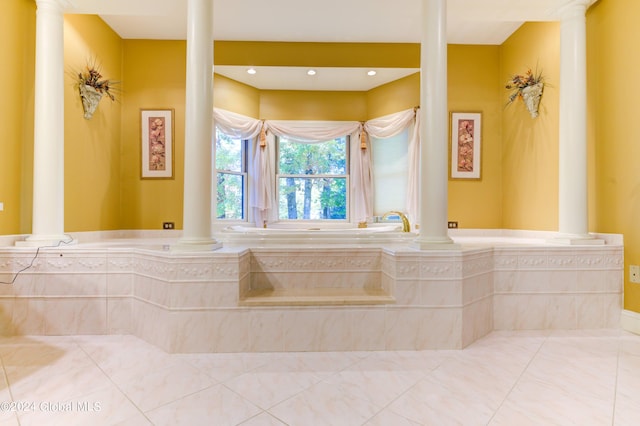 bathroom featuring a relaxing tiled tub and tile patterned floors