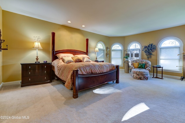 bedroom with light colored carpet