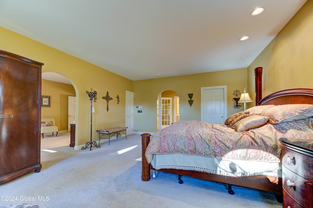 bedroom featuring light colored carpet