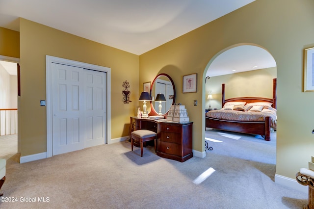 carpeted bedroom with a closet