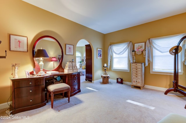 sitting room featuring light colored carpet