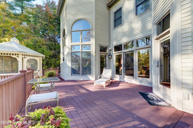 wooden deck featuring a gazebo