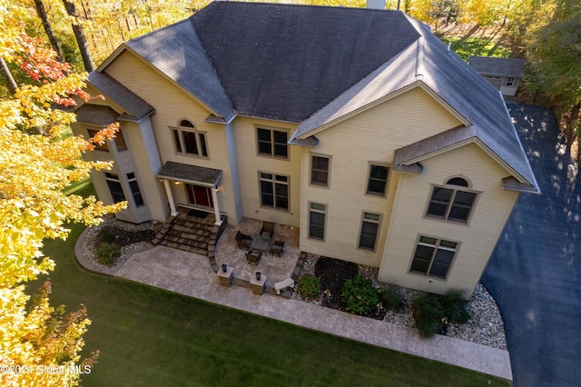 view of front facade with a patio area and a front lawn