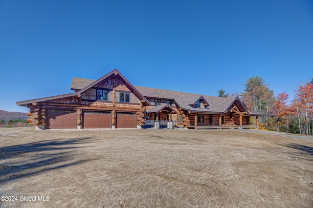 cabin featuring a garage