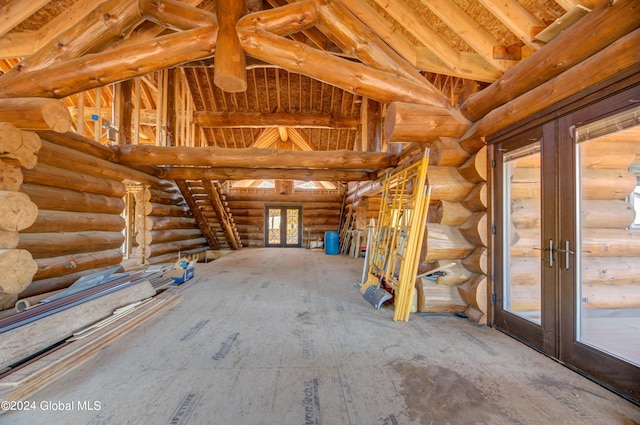 misc room with vaulted ceiling with beams, french doors, and log walls