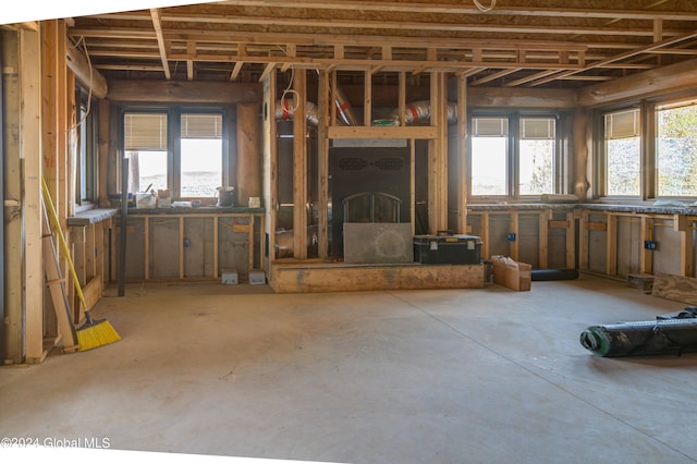 misc room featuring concrete flooring and a wealth of natural light