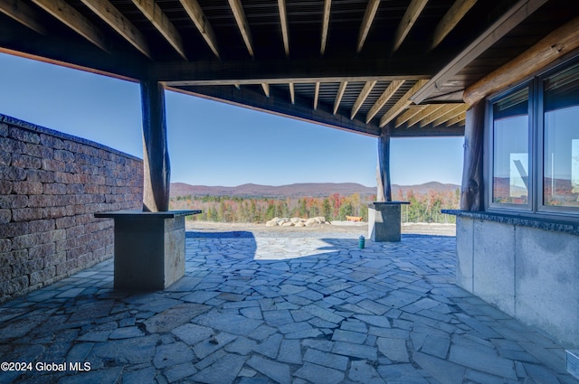 view of patio / terrace with a mountain view