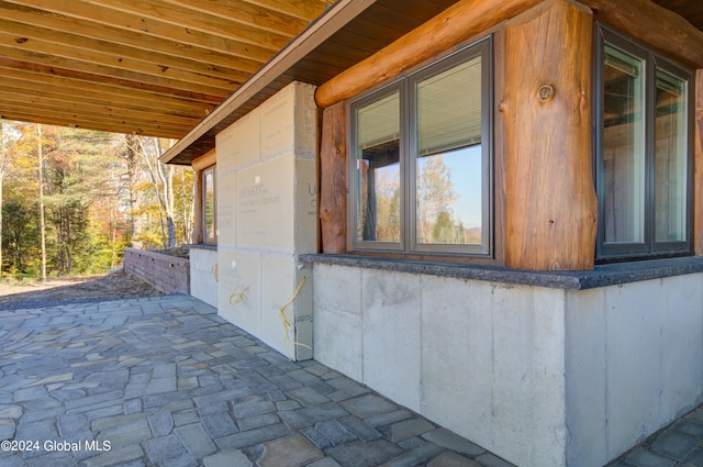 view of side of property with a patio area