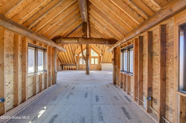 attic featuring a wealth of natural light