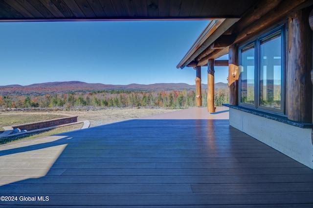 view of pool featuring a deck with mountain view