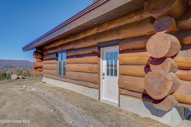 view of side of property with a mountain view