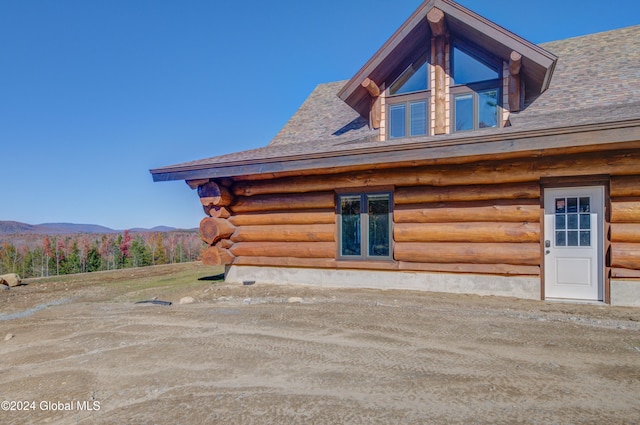 exterior space featuring a mountain view