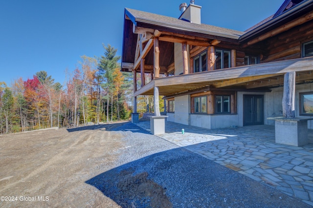 view of property exterior featuring a patio