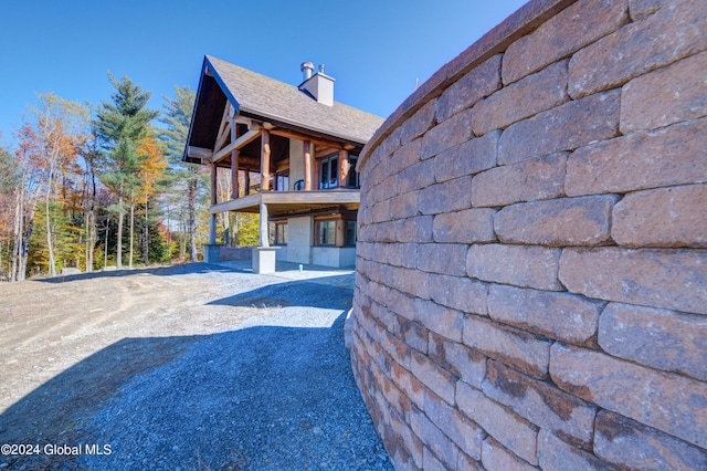 view of side of home featuring a patio area