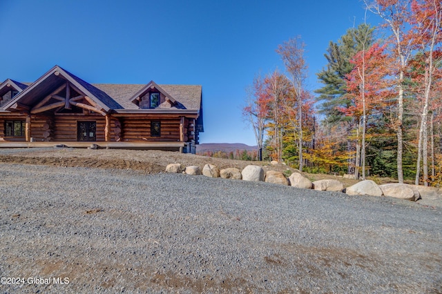 view of log cabin