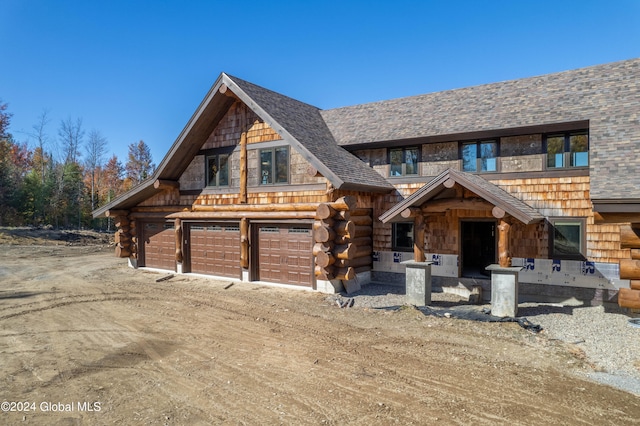 cabin featuring a garage