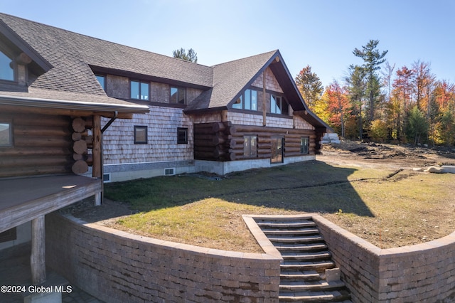 view of property exterior with a lawn