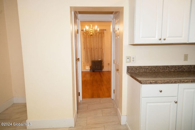 hall featuring light hardwood / wood-style floors and radiator