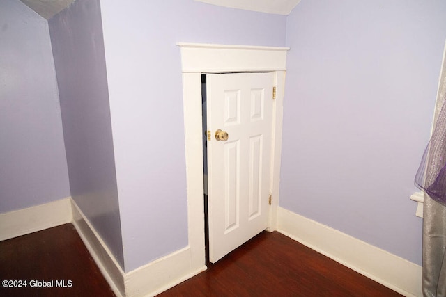 hallway featuring dark hardwood / wood-style floors