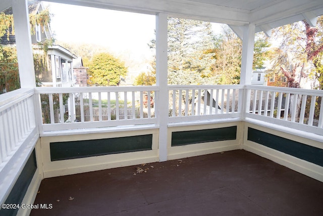 unfurnished sunroom featuring plenty of natural light