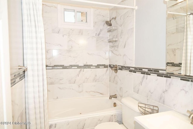 full bath featuring shower / tub combo with curtain, toilet, tile walls, and vanity
