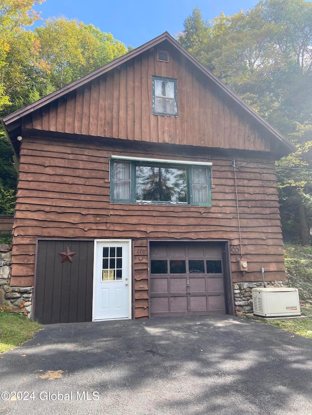 view of property exterior with a garage