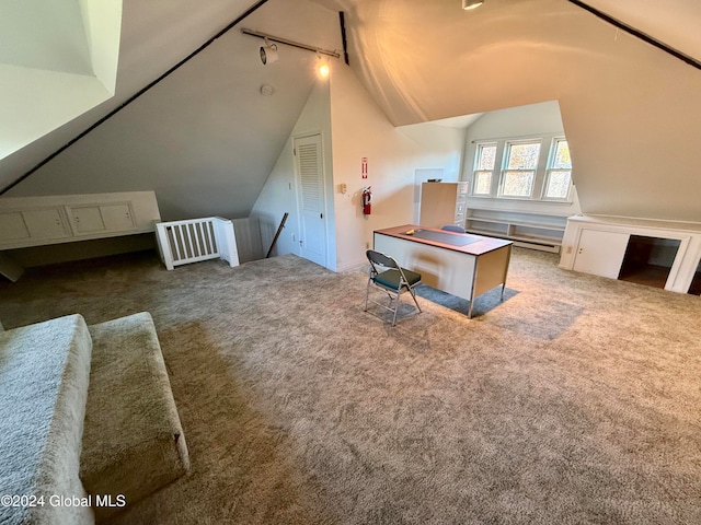 bonus room with carpet floors and vaulted ceiling