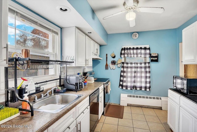 kitchen featuring black appliances, sink, a baseboard radiator, white cabinets, and decorative backsplash