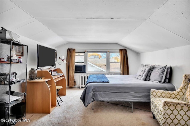 bedroom with light carpet, radiator heating unit, and vaulted ceiling