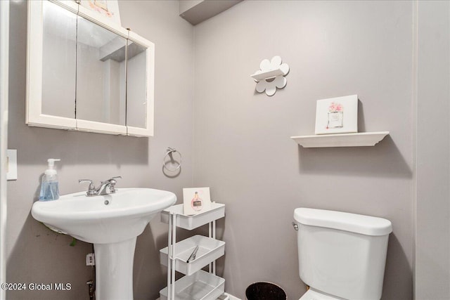 bathroom featuring sink and toilet