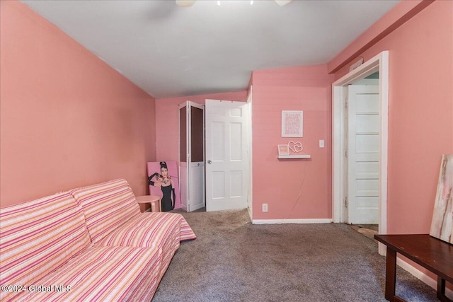 unfurnished bedroom with carpet flooring, ceiling fan, and vaulted ceiling