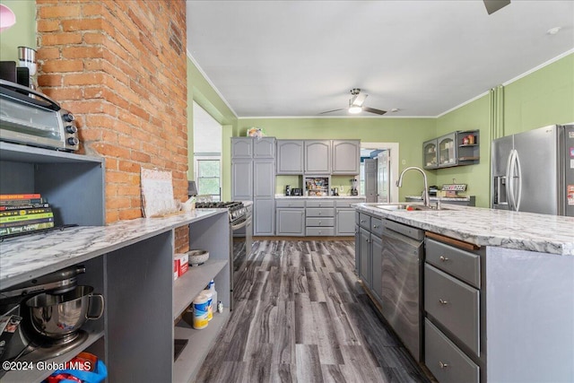 kitchen with gray cabinetry, ceiling fan, sink, dark hardwood / wood-style flooring, and appliances with stainless steel finishes